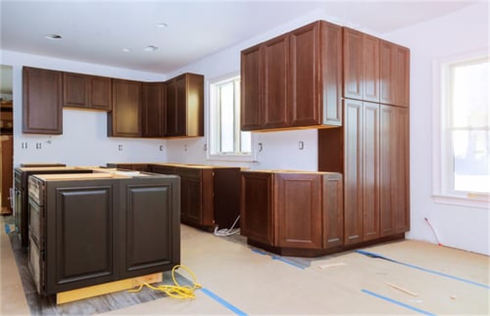 New kitchen cabinetry being installed during a full home remodel in a Denver, CO house