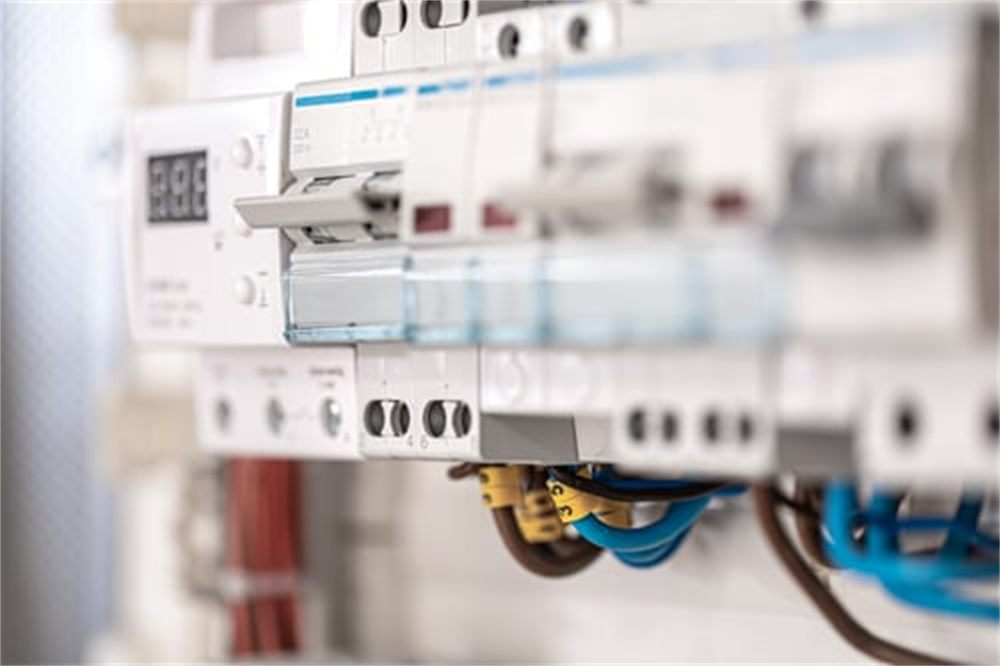 Close-up of a residential electrical panel with breakers and labeled circuit wiring installed in a Denver, CO home